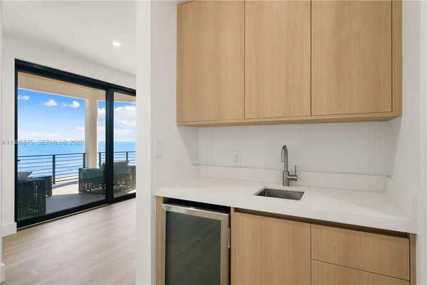 a bedroom with a large bed and a large window