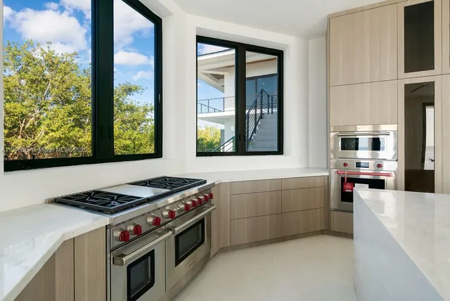 a bathroom with a double vanity sink and mirror