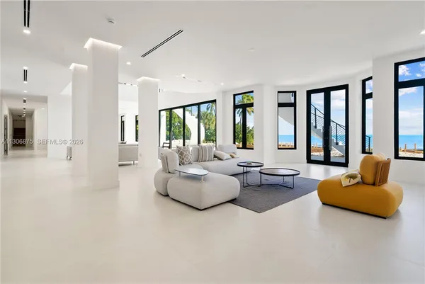 a view of a a dining room with furniture window and outside view
