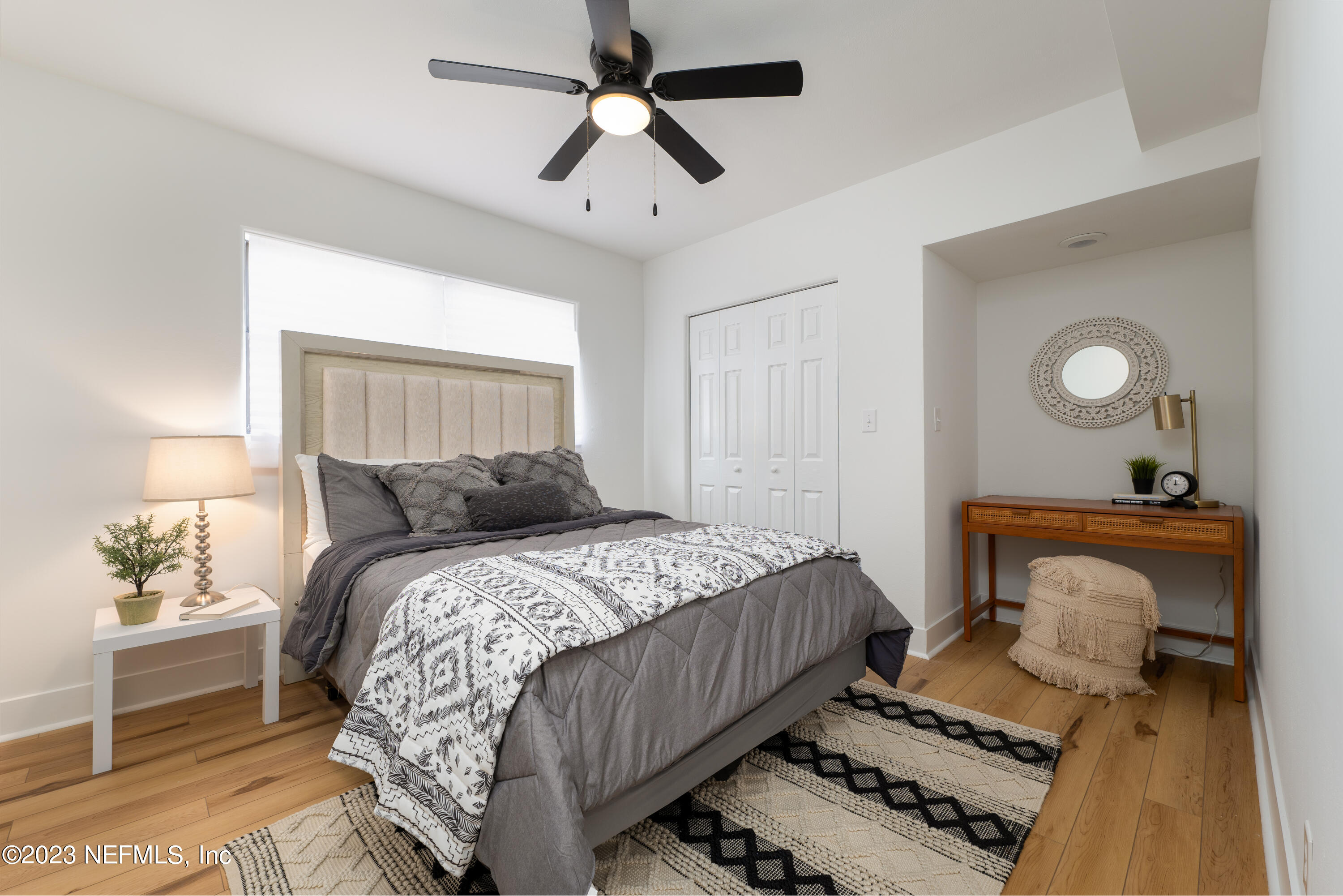 140 Ferrol Road St. Augustine, FL 32084 - Photo 20 of 27 a bedroom with a bed and wooden floor
