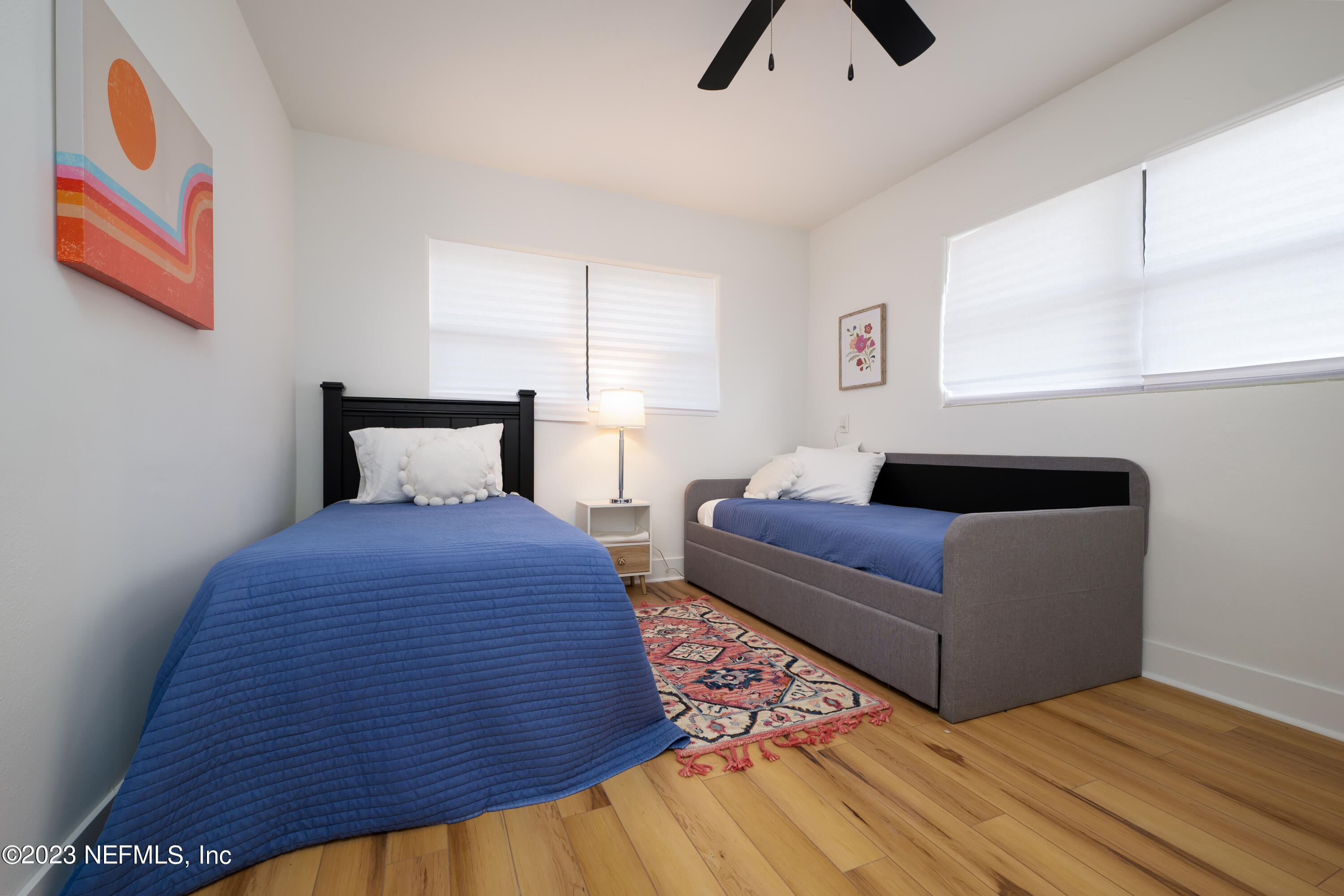 140 Ferrol Road St. Augustine, FL 32084 - Photo 23 of 27 a bedroom with furniture and a large window