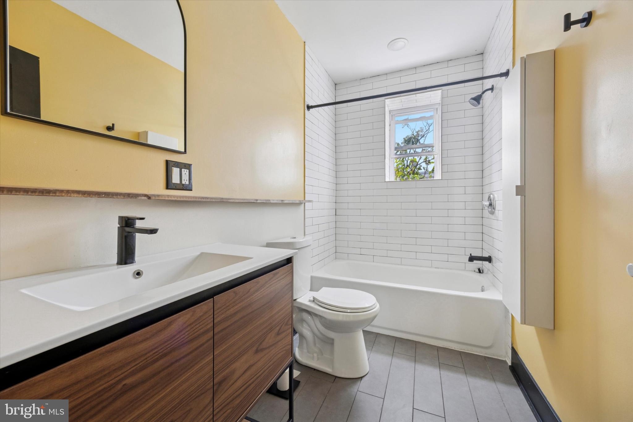 5310 Spruce Street, Unit 2 Philadelphia, PA 19139 - Photo 11 of 19 a bathroom with a sink a toilet and shower