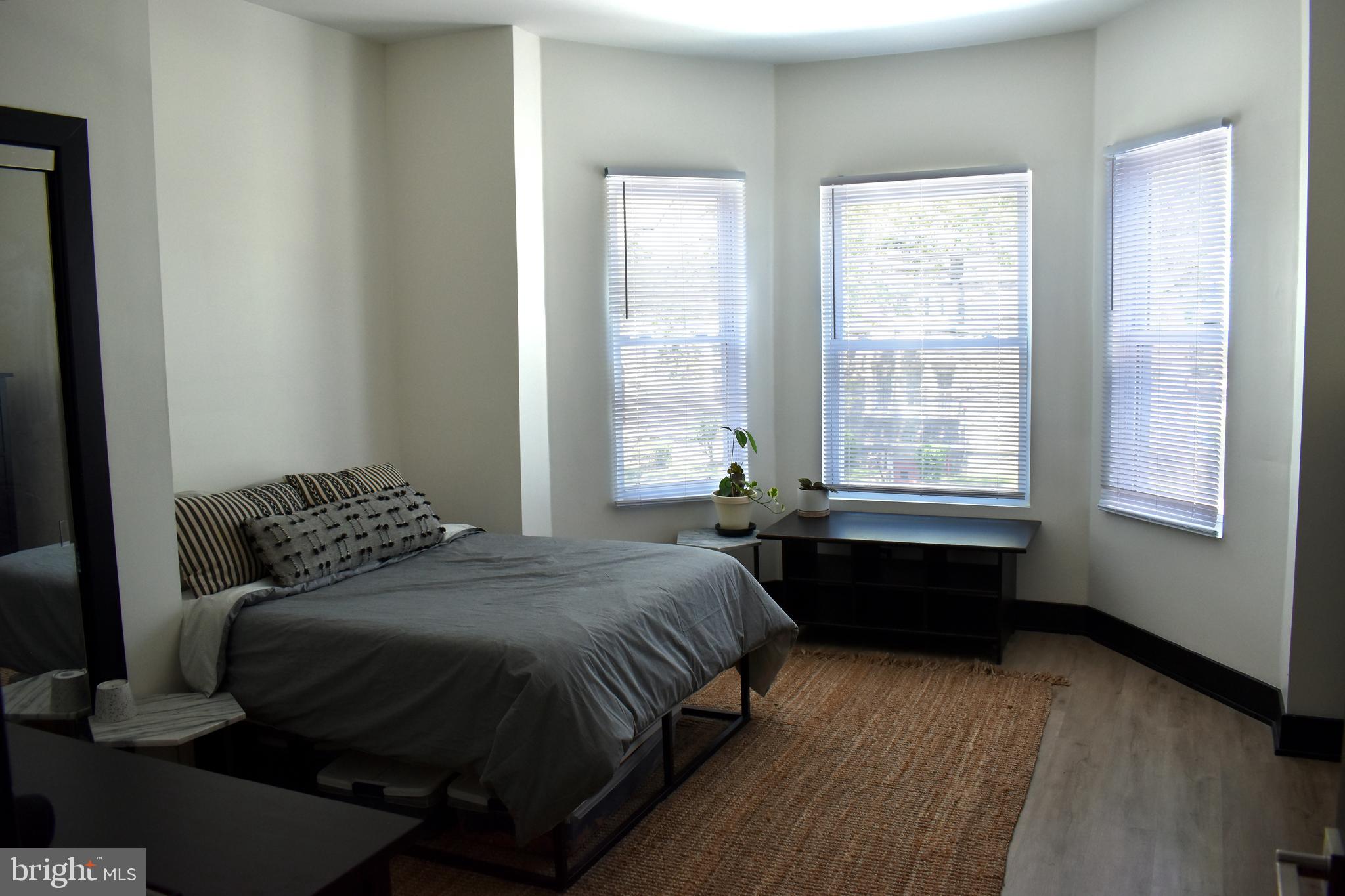 5310 Spruce Street, Unit 2 Philadelphia, PA 19139 - Photo 18 of 19 a bedroom with a bed and a window