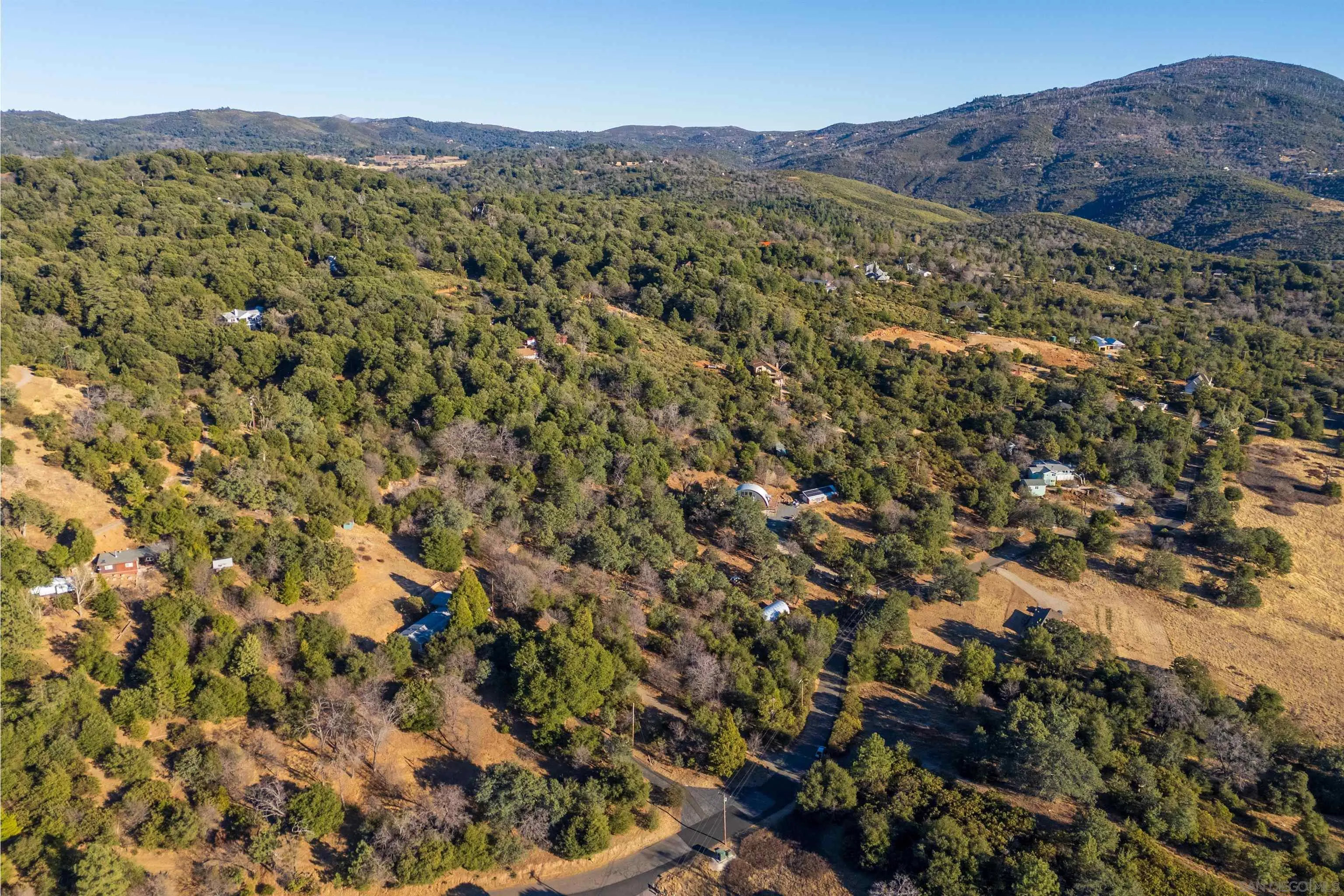 5298 Pine Hills Road, Unit 1 Julian, CA 92036 - Photo 16 of 21 a view of a mountain range with lush green forest