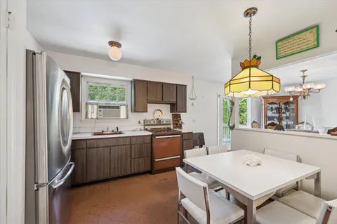 a kitchen with sink cabinets and window