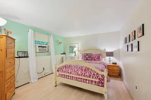 a bedroom with a bed and a view of bedroom