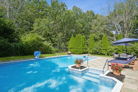 a view of a swimming pool with a patio
