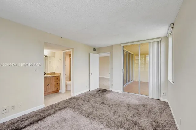 a view of hallway with bathroom and bathroom