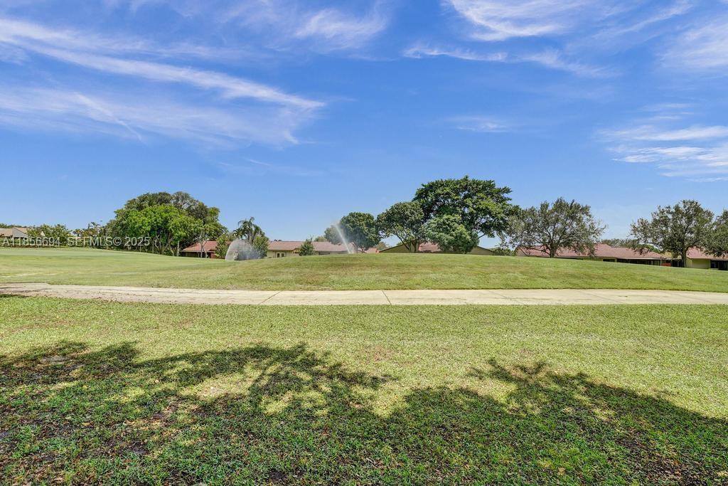9520 Seagrape Drive, Unit 306 Davie, FL 33324 - Photo 18 of 20 a view of an ocean and a yard