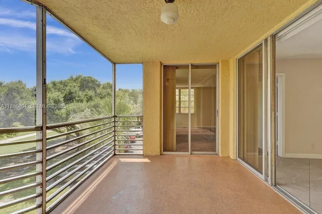 a view of a room with a large window