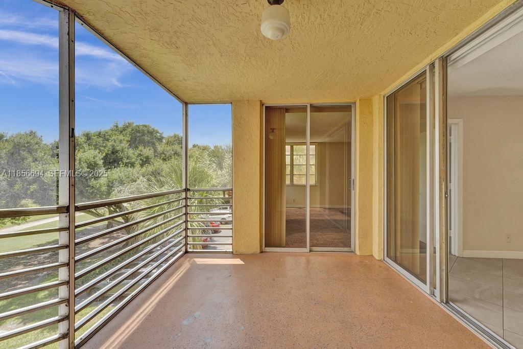 9520 Seagrape Drive, Unit 306 Davie, FL 33324 - Photo 5 of 20 a view of a room with a large window