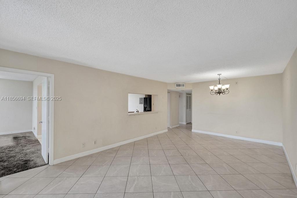 9520 Seagrape Drive, Unit 306 Davie, FL 33324 - Photo 9 of 20 wooden floor in an empty room