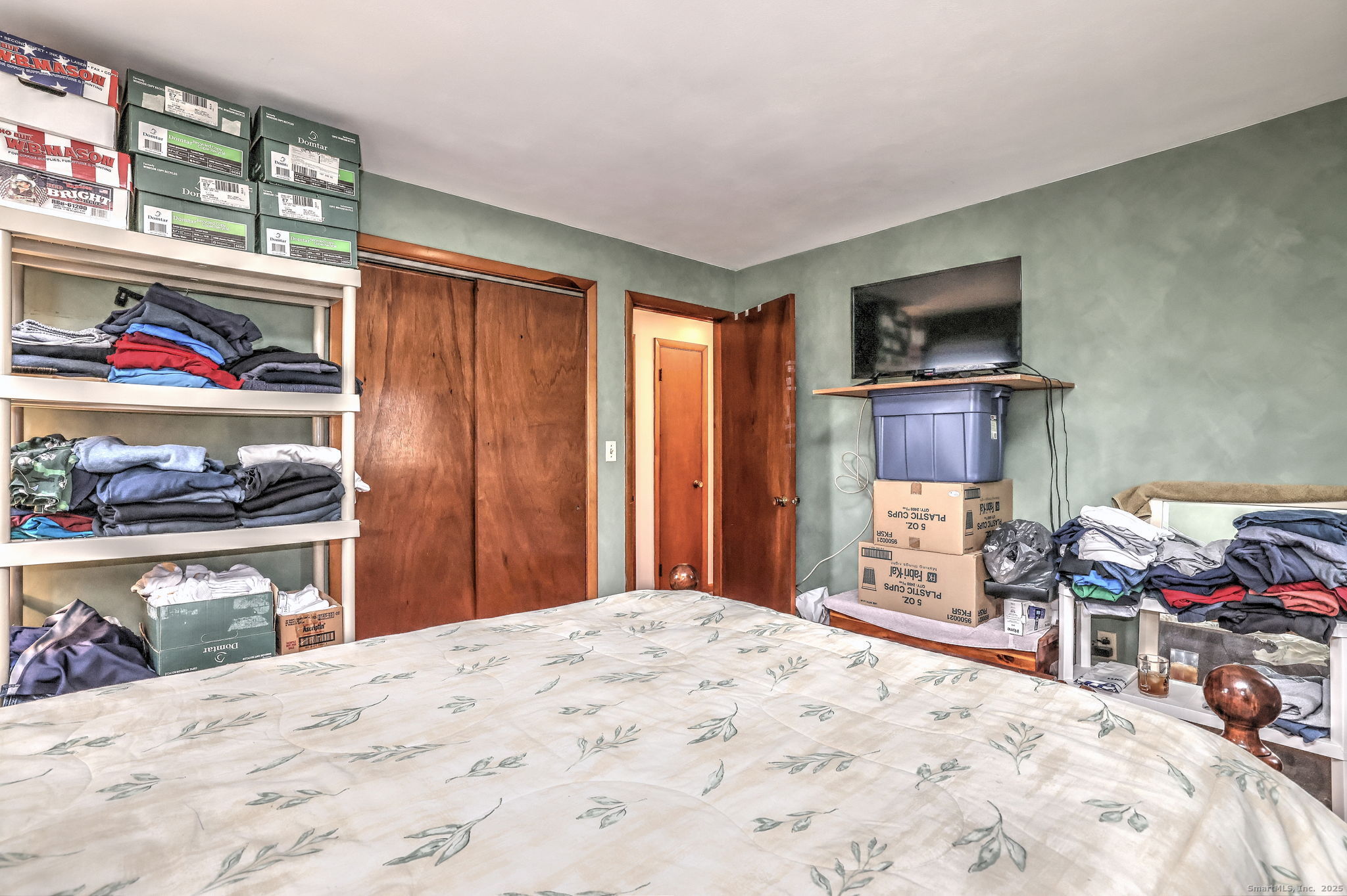 15 Utica Street Milford, CT 06461 - Photo 23 of 39 a bed room with a bed and a television