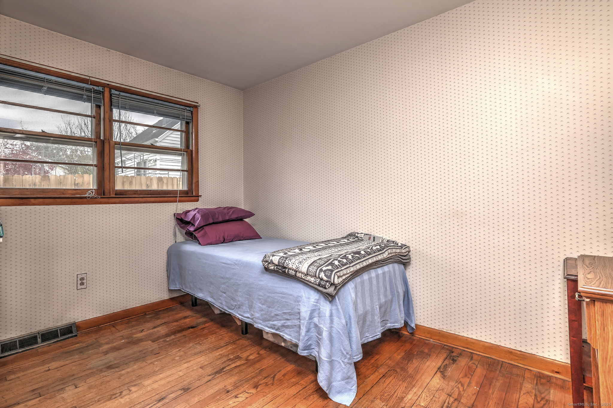 15 Utica Street Milford, CT 06461 - Photo 26 of 39 a bedroom with a bed and a window