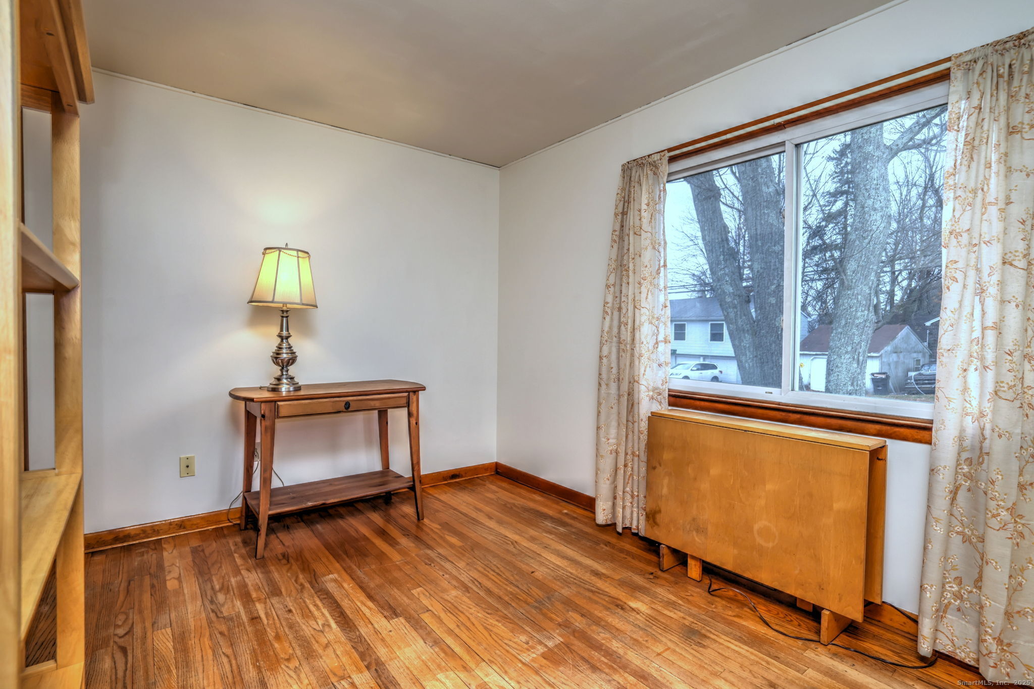 15 Utica Street Milford, CT 06461 - Photo 30 of 39 a view of a room with a window and wooden floor