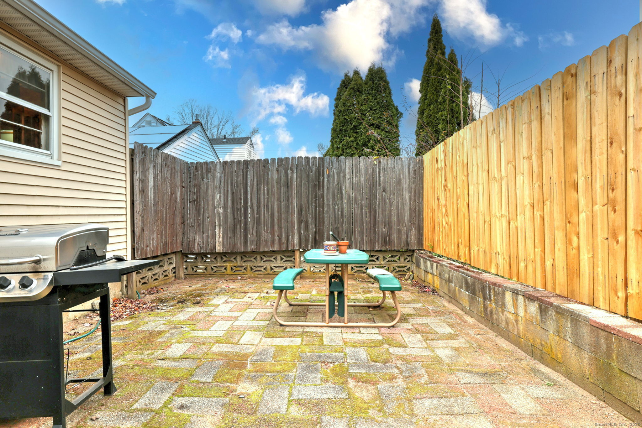 15 Utica Street Milford, CT 06461 - Photo 39 of 39 a backyard of a house with yard and outdoor seating