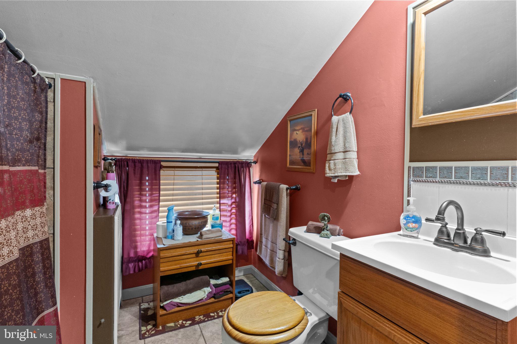 67 Greenbriar Road Levittown, PA 19057 - Photo 14 of 24 a bathroom with a sink toilet and mirror