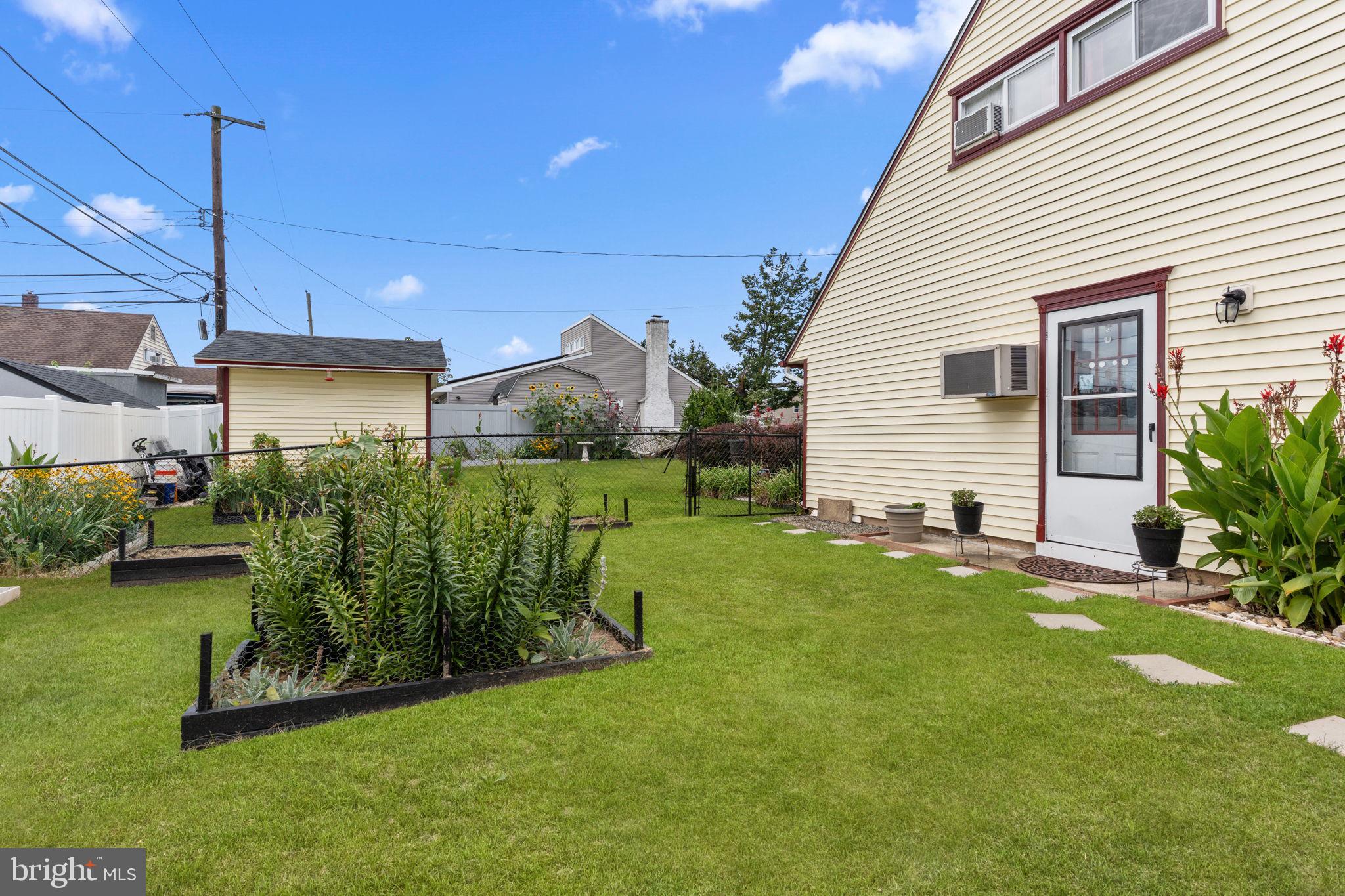 67 Greenbriar Road Levittown, PA 19057 - Photo 17 of 24 a view of a house with backyard and sitting area