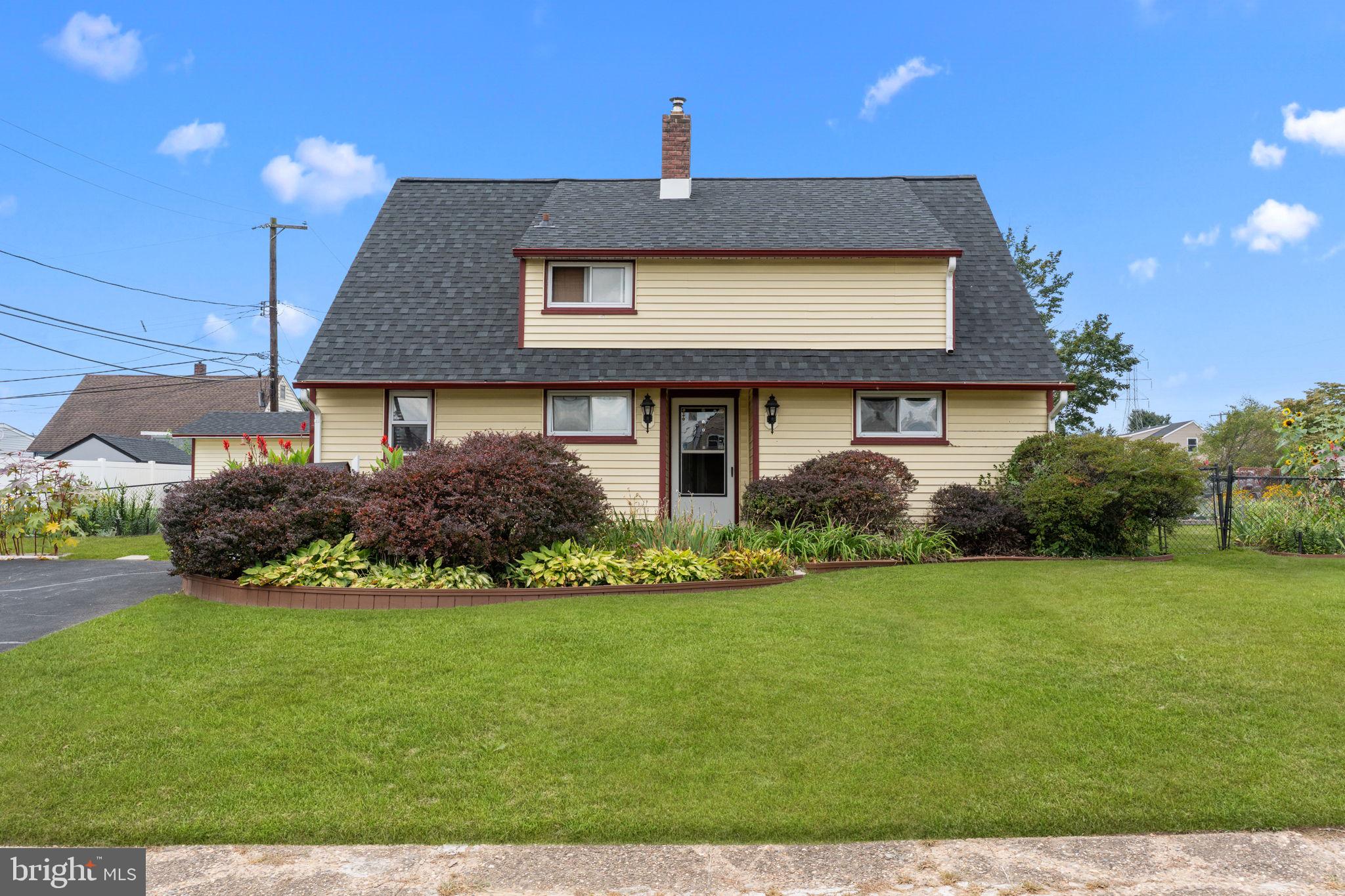 67 Greenbriar Road Levittown, PA 19057 - Photo 2 of 24 a front view of a house with a yard