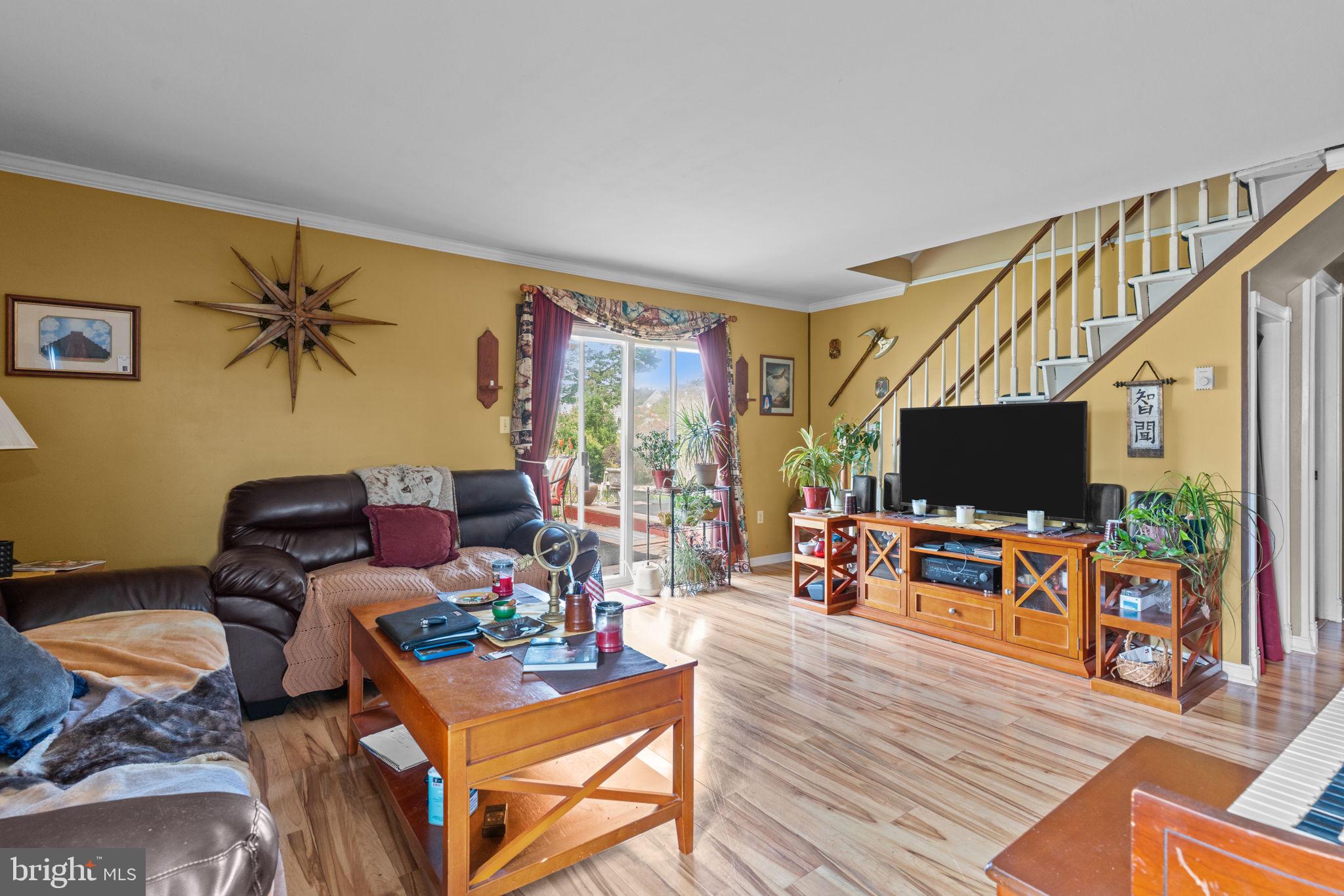67 Greenbriar Road Levittown, PA 19057 - Photo 4 of 24 a living room with furniture and a flat screen tv