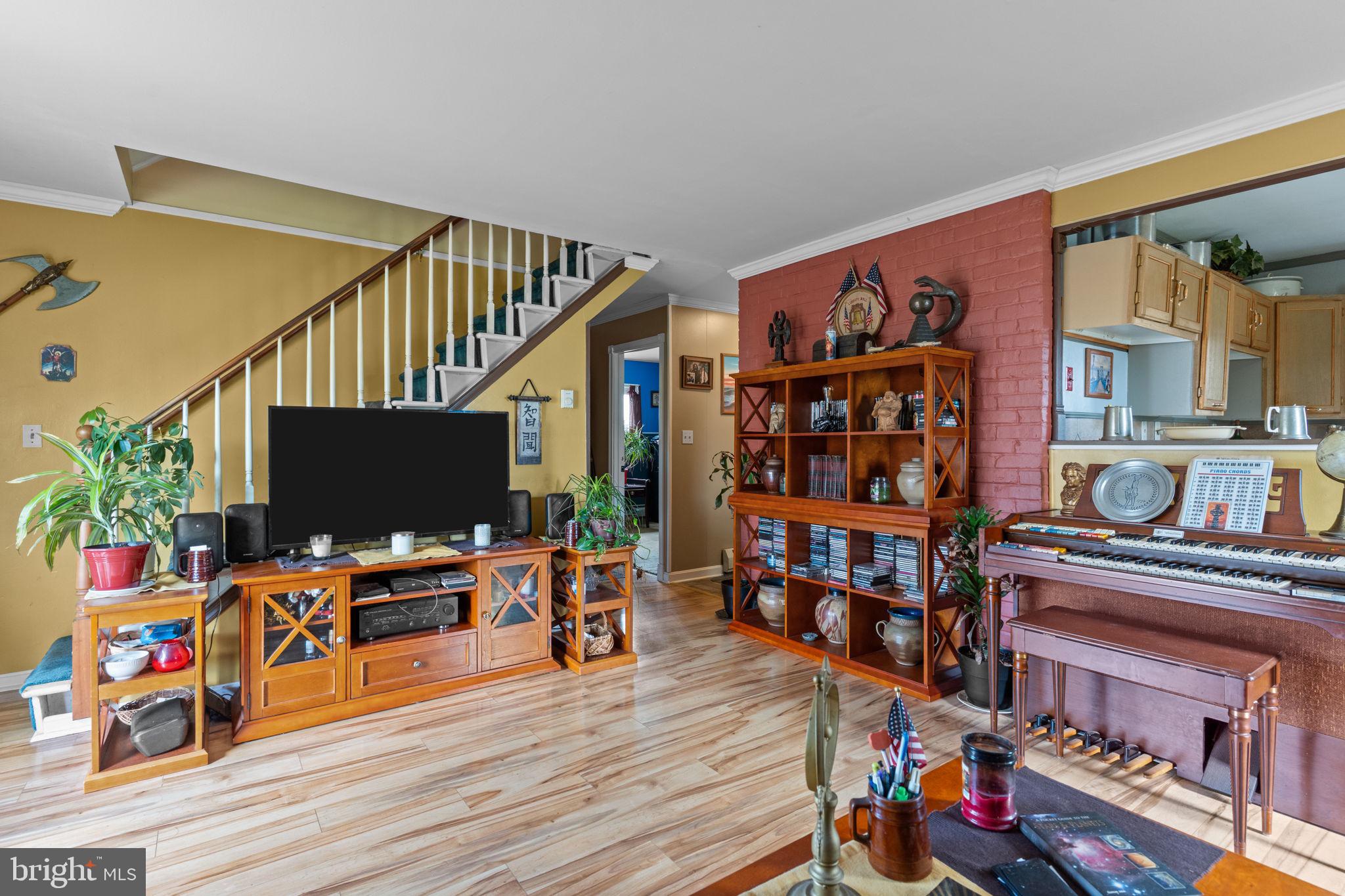67 Greenbriar Road Levittown, PA 19057 - Photo 5 of 24 a room with furniture and a flat screen tv