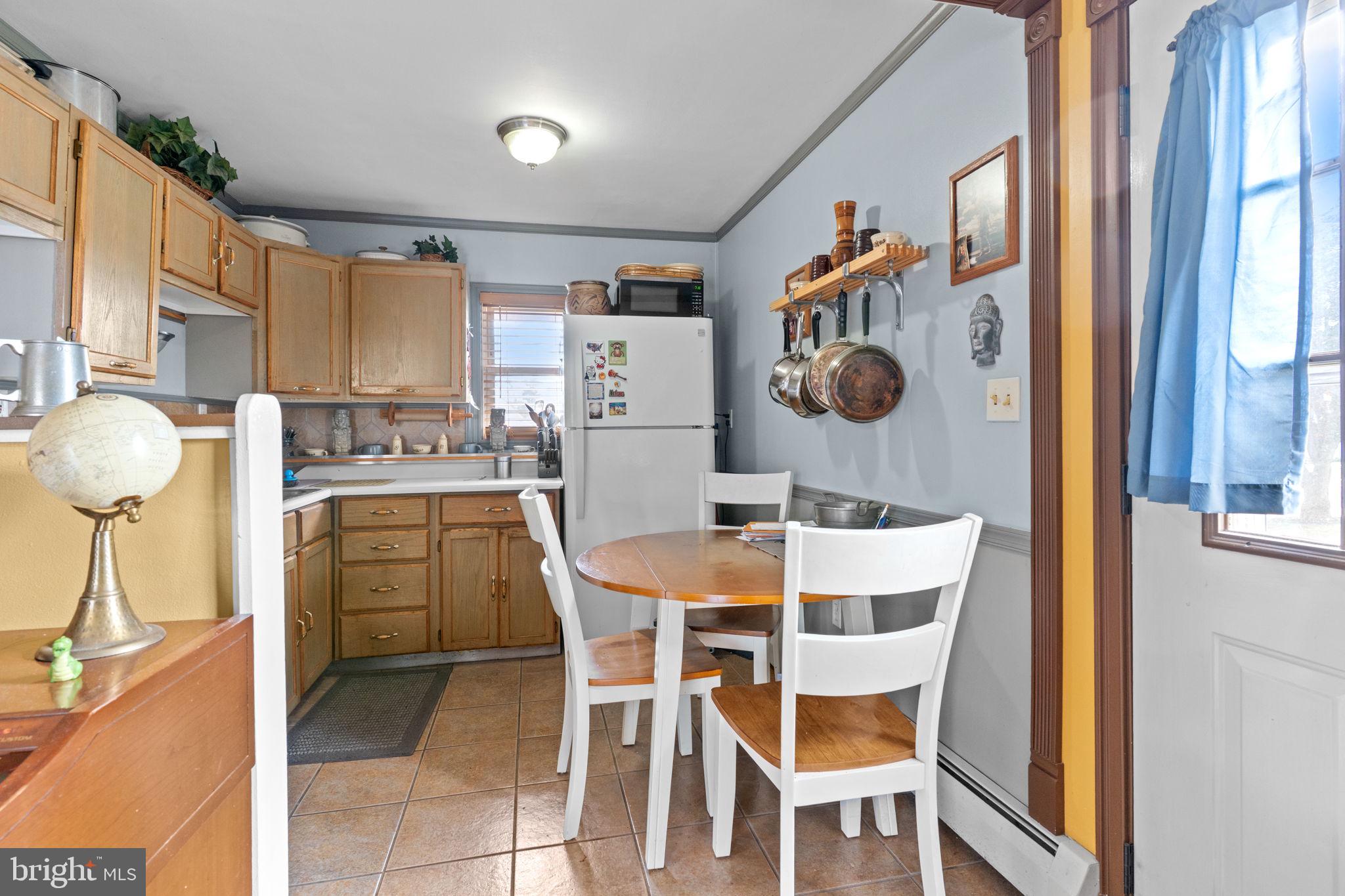 67 Greenbriar Road Levittown, PA 19057 - Photo 6 of 24 a dining room with furniture and a chandelier