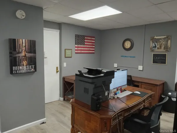a view of a workspace with furniture