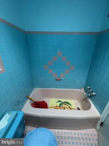 a bathroom with a bath tub