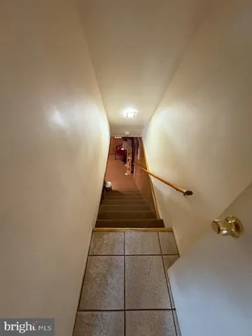 a dining room with furniture and a chandelier