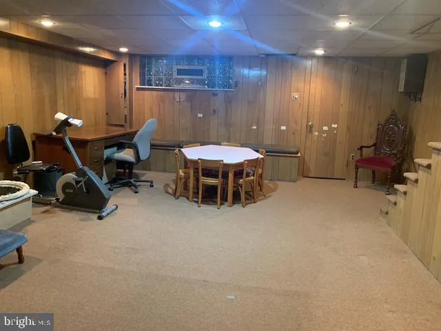 a bed room with furniture and a flat screen tv