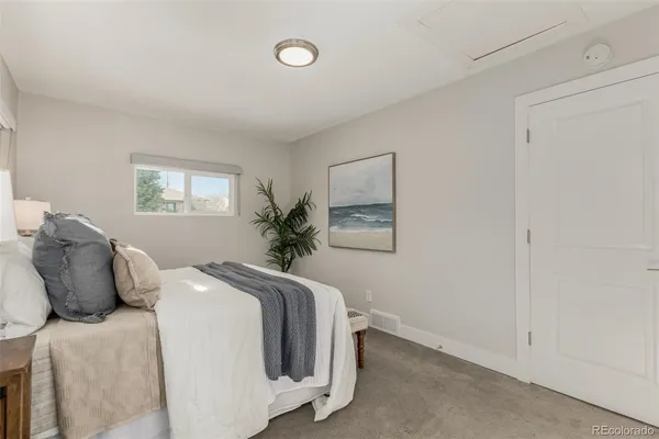 a bedroom with bed and window