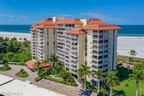 180 Seaview Court, Unit 111 Marco Island, FL 34145 - Photo 19 of 24 a front view of a multi story building with yard