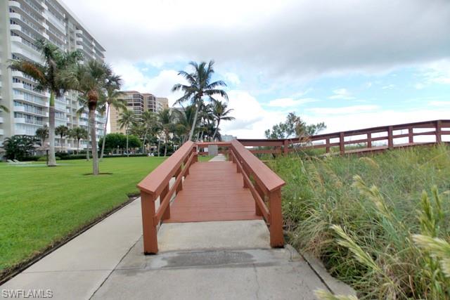 180 Seaview Court, Unit 111 Marco Island, FL 34145 - Photo 20 of 24 a view of a backyard with plants and lake view