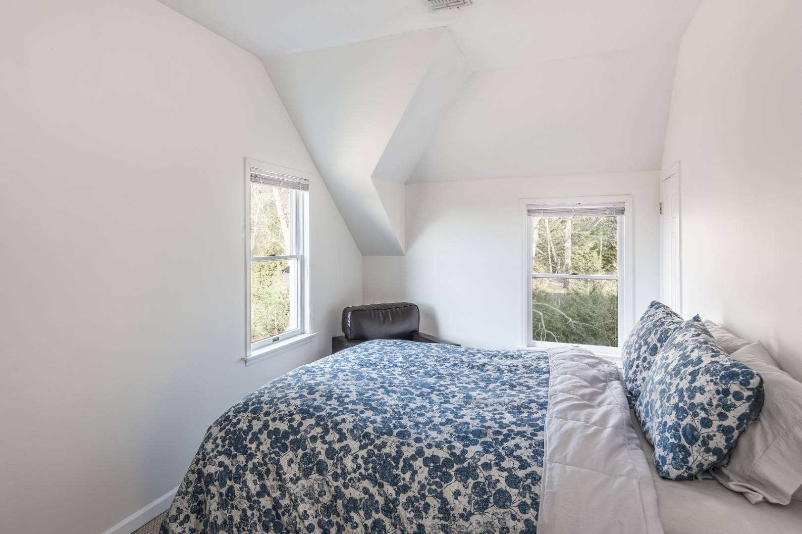 56 South Country Road Westhampton, NY 11977 - Photo 13 of 15 a bedroom with a bed and a window