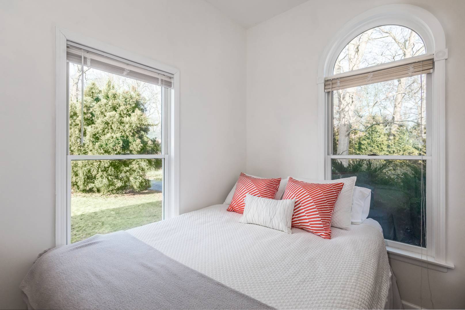 56 South Country Road Westhampton, NY 11977 - Photo 15 of 15 a bedroom with a bed and a window