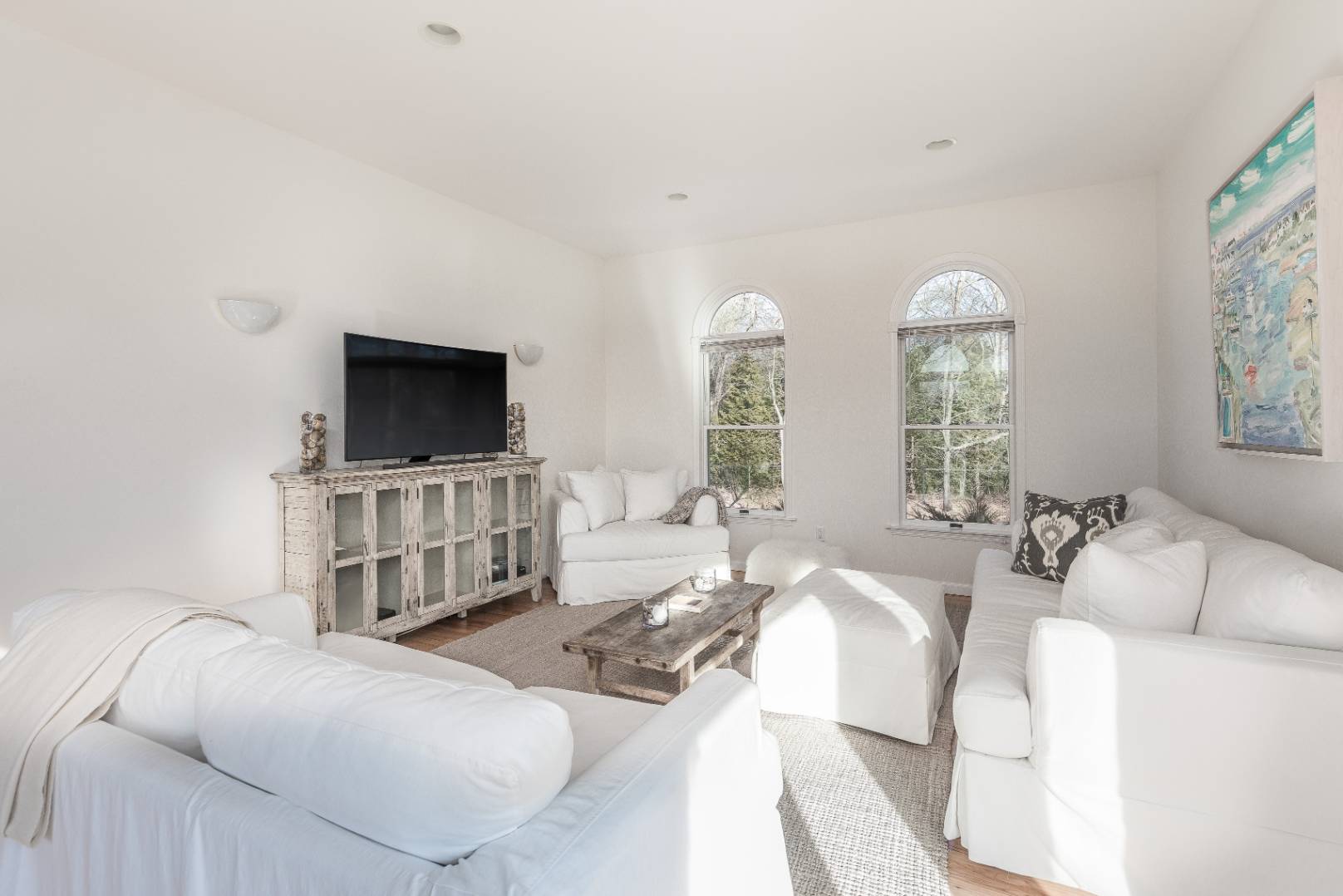 56 South Country Road Westhampton, NY 11977 - Photo 4 of 15 a living room with furniture and a flat screen tv