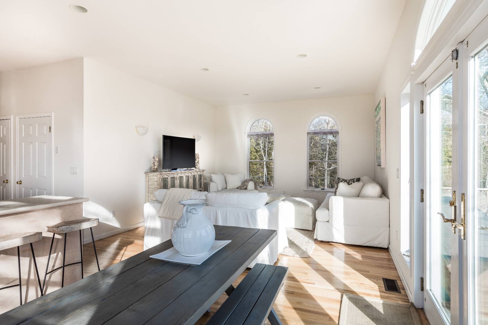 56 South Country Road Westhampton, NY 11977 - Photo 5 of 15 a living room with furniture and a flat screen tv