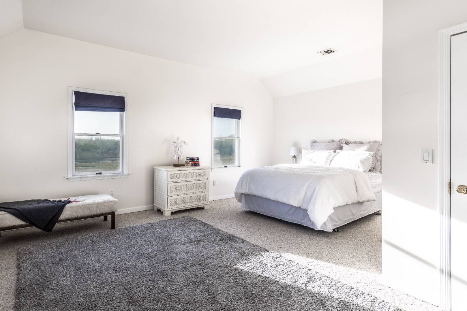 56 South Country Road Westhampton, NY 11977 - Photo 9 of 15 a bedroom with bed and a couch