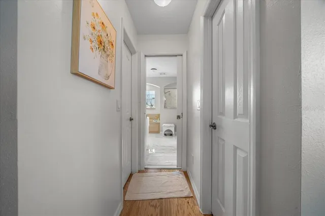 a spacious en suite bathroom with a large tub sink and window