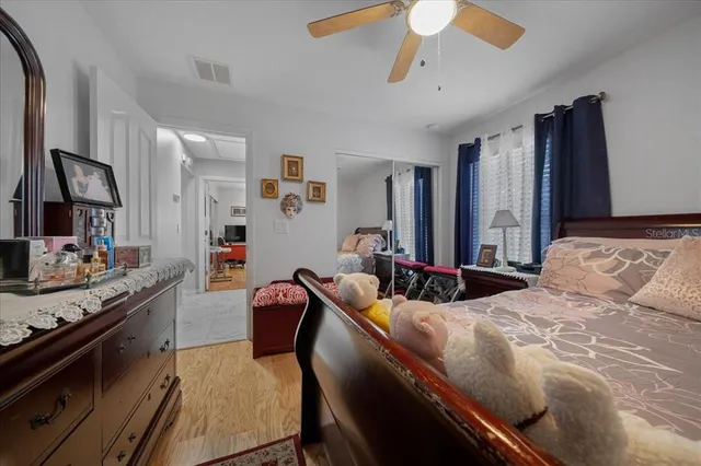 a bedroom with bed and window