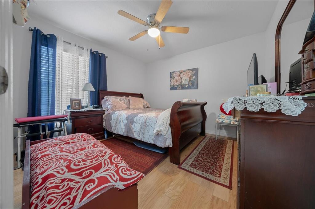 4997 Southwest 107th Loop Ocala, FL 34476 - Photo 31 of 48 a bedroom with bed and window