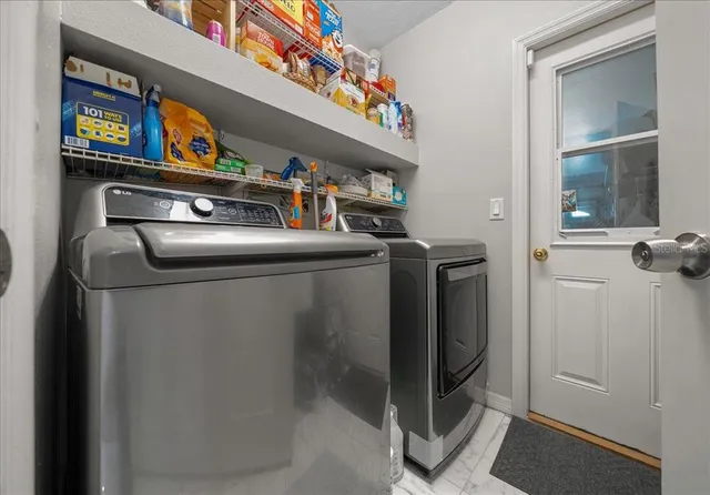 a kitchen with a refrigerator and a sink