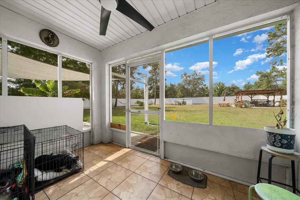 4997 Southwest 107th Loop Ocala, FL 34476 - Photo 34 of 48 a living room with a large window