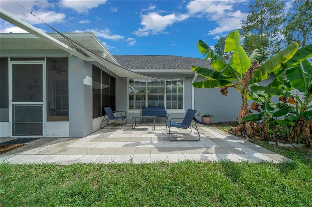 4997 Southwest 107th Loop Ocala, FL 34476 - Photo 36 of 48 a view of house with backyard and porch