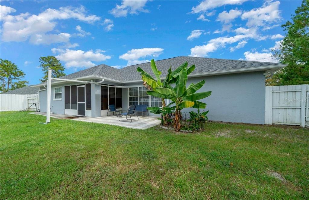 4997 Southwest 107th Loop Ocala, FL 34476 - Photo 40 of 48 a front view of house with yard and porch