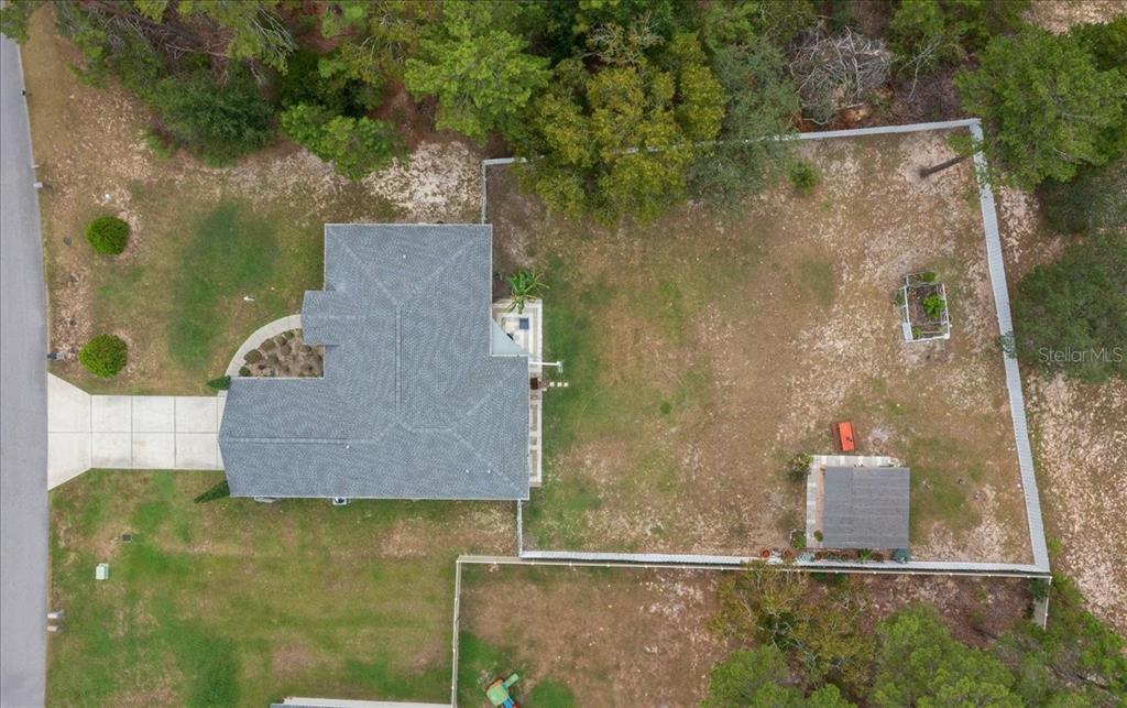 4997 Southwest 107th Loop Ocala, FL 34476 - Photo 47 of 48 an aerial view of a residential houses with outdoor space