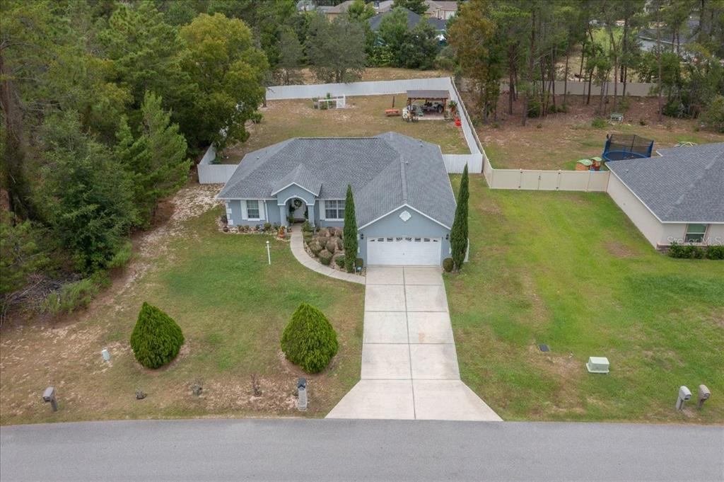 4997 Southwest 107th Loop Ocala, FL 34476 - Photo 48 of 48 an aerial view of a house with yard