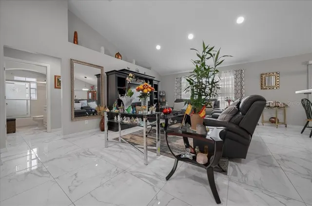 a view of a livingroom with furniture and a potted plant