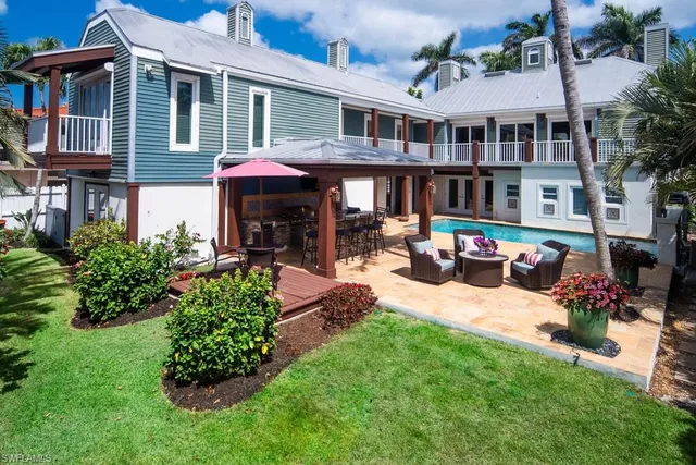 a front view of a brick house with a yard