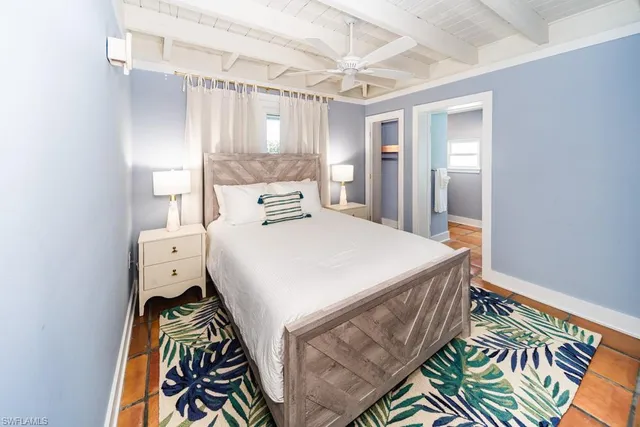 a bathroom with a granite countertop shower a toilet and a sink
